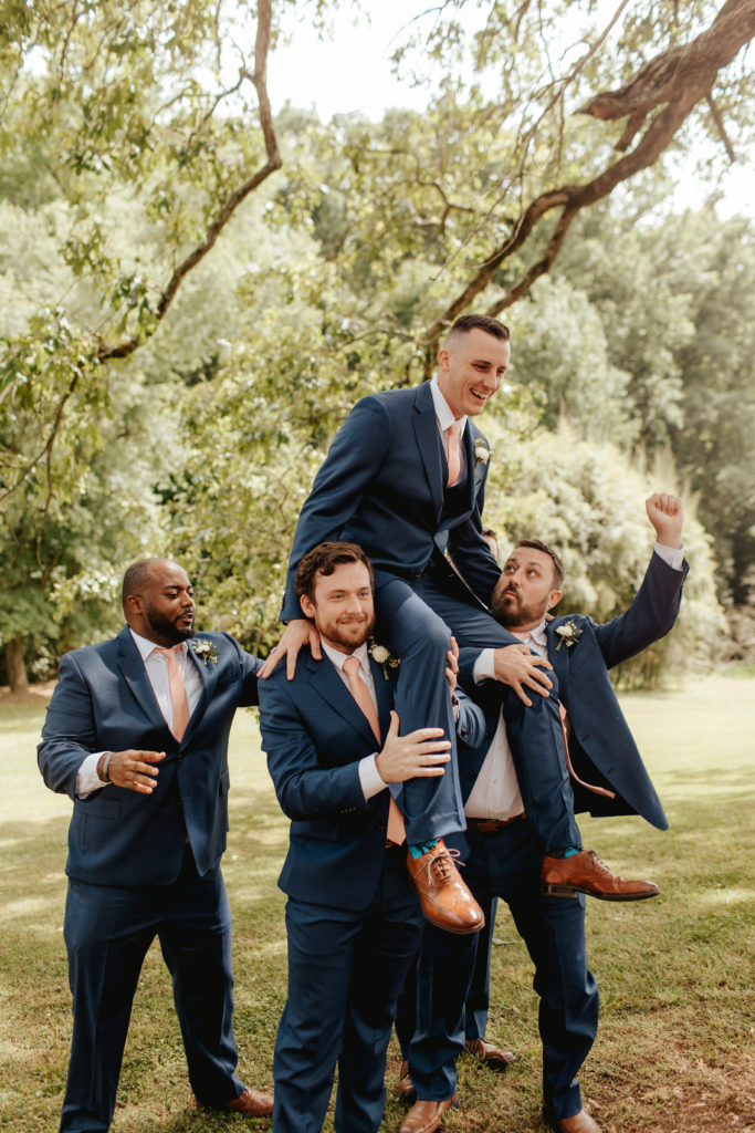 groom and groomsmen having fun before wedding