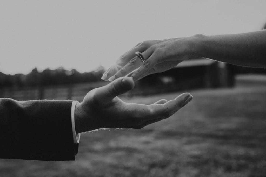wedding photo with hands and wedding rings
