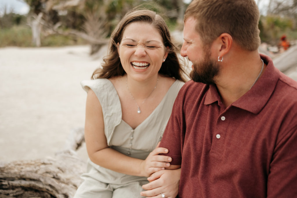 Newly engaged couple at Jekyll Island Driftwood Beach engagement session